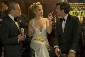 Gary Craig, Jennifer Lawrence, and Jack Huston in a scene from 'American Hustle' 