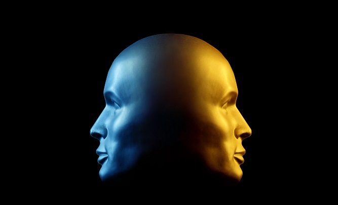 Two-faced head statue, blue and gold